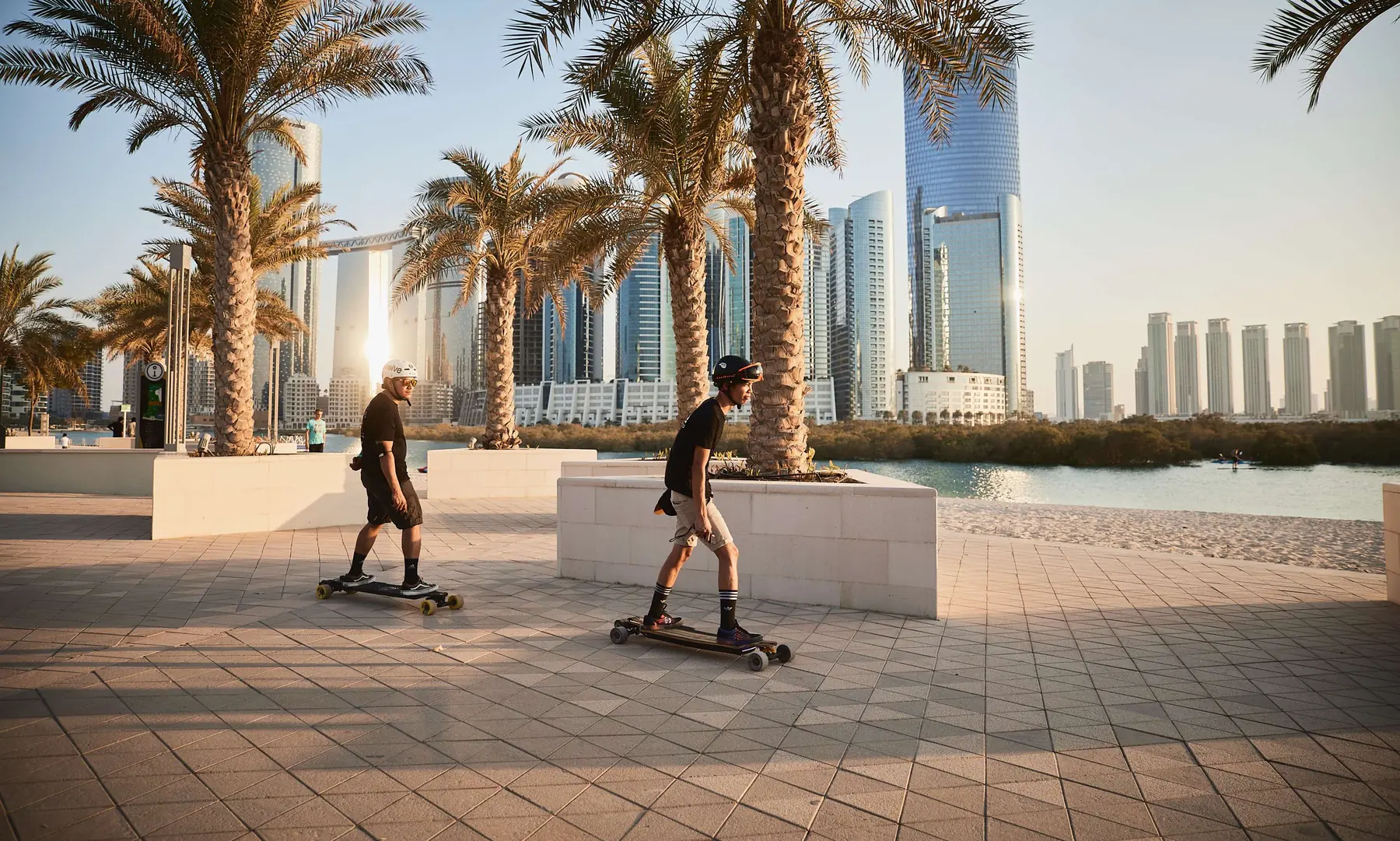 Skateboarders on the Yas waterfront promenade