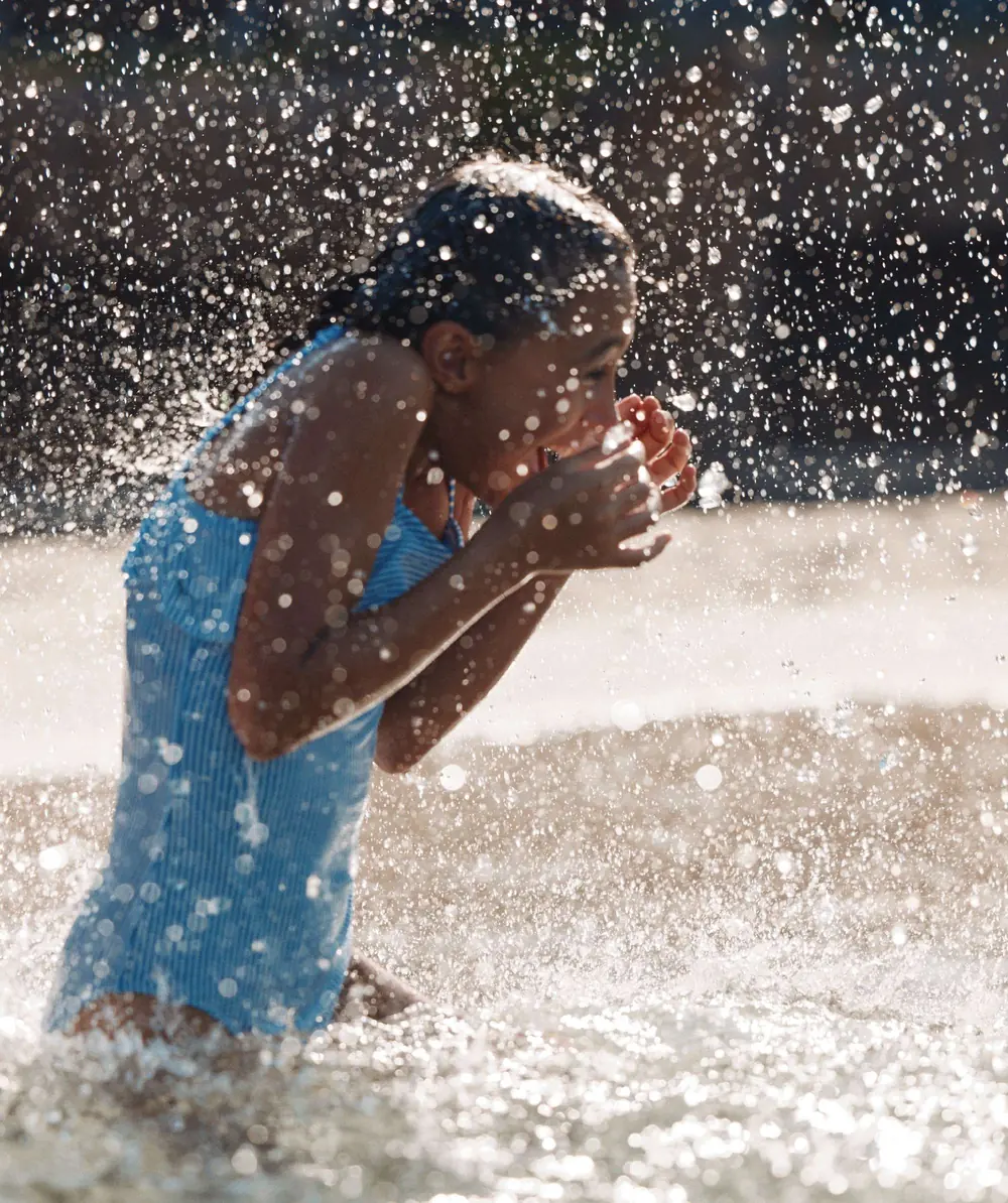 A child playing in a splash pad