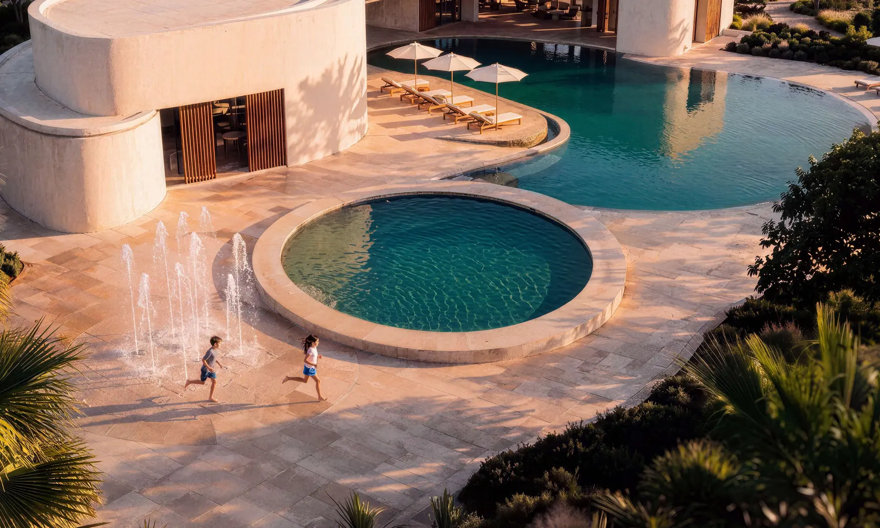 Children run beside the clubhouse pools
